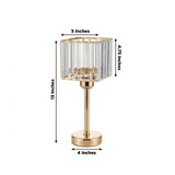 Gold base table lamp with clear ribbed shade, dimensions: 13" height, 5" width.