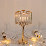 Elegant glass table lamp with gold accents, illuminated on a dining table.