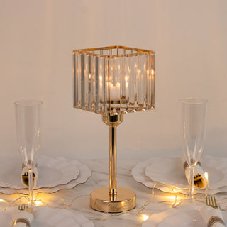 Elegant crystal table lamp with gold accents on a dining table setting.
