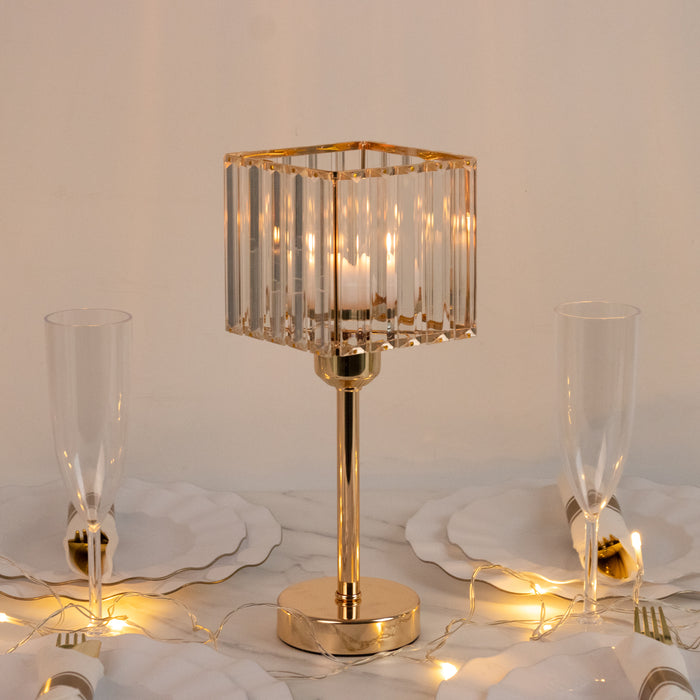 Elegant crystal table lamp with gold accents on a dining table setting.