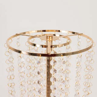 Gold jewelry stand with crystal accents, showcasing elegant design.
