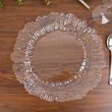 Clear decorative plate with a ruffled edge on a wooden table.