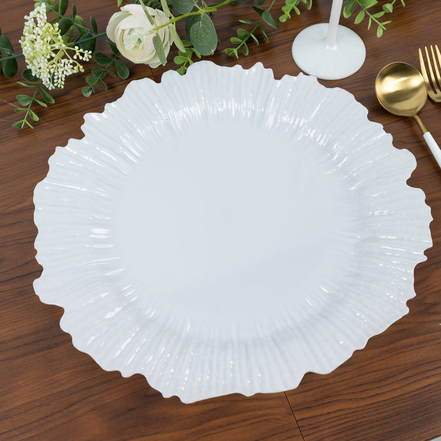 Elegant white ruffled plate on a wooden table.