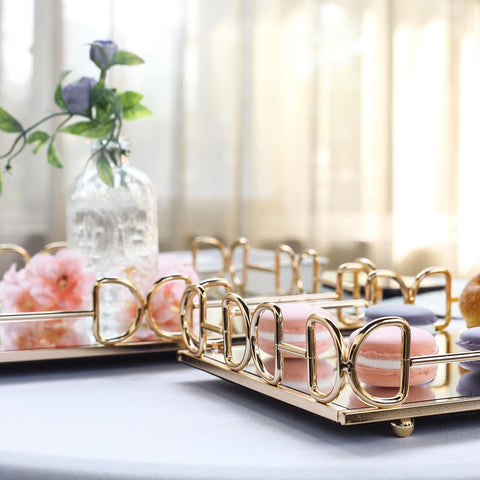 Gold tray with pink macarons and a glass vase