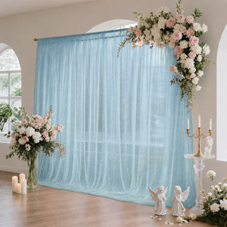 Elegant wedding floral backdrop with blue tulle curtain and candles