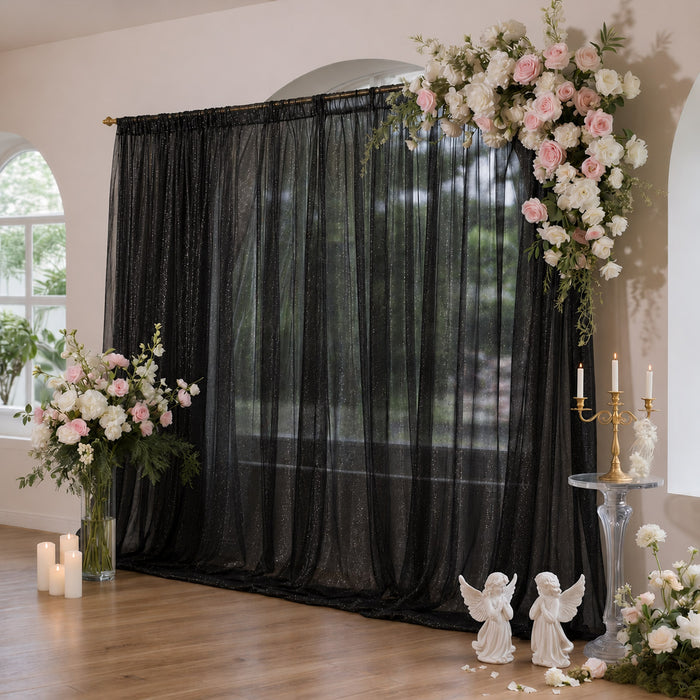 Black sheer backdrop with pink and white floral wedding arch decor
