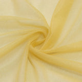 Soft yellow sheer fabric swirl texture close-up#whtbkgd