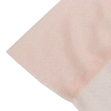 Close-up of pale pink glitter fabric texture on white background