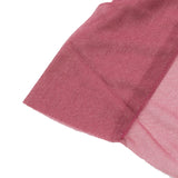 Pink sheer organza fabric close-up with soft texture and shimmering finish