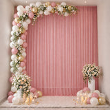 Pink and gold balloon arch with floral wedding or baby shower backdrop