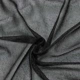 Black sheer mesh fabric texture with soft folds and draped layers#whtbkgd