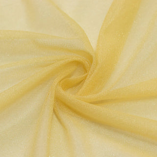 Soft yellow fabric swirl close-up with sheer texture and elegant folds#whtbkgd