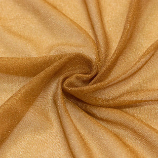 Golden metallic fabric texture with elegant swirl folds#whtbkgd
