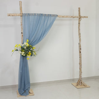 Wooden frame with blue drapery and floral arrangement for events.