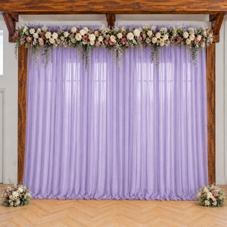 Lavender wedding backdrop with floral garland and rustic wooden arch
