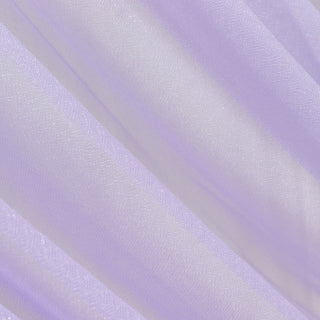 Sheer lavender fabric draping with soft texture and light reflection.