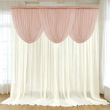 Pink draped curtain set against a light-colored backdrop.