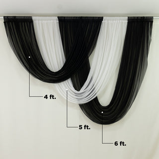 Draped black and white fabric backdrop for events or photography.