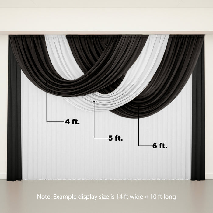 Draped black and white fabric backdrop for events or photography.
