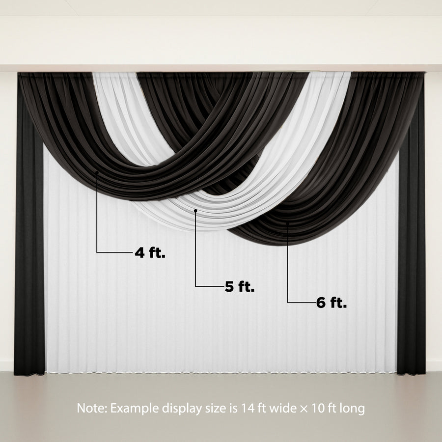 Draped black and white fabric backdrop for events or photography.