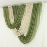 Green and cream sheer curtain panels hung on a rod