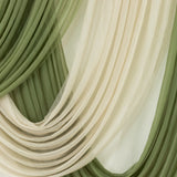 Sheer draped curtains in olive green and cream colors.