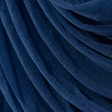 Navy draped fabric showcasing elegant texture and flow. #whtbkgd