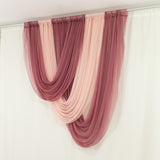 Elegant draped fabric curtains in blush and burgundy colors.