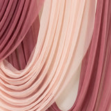 Layered sheer fabric in soft pink and mauve tones.