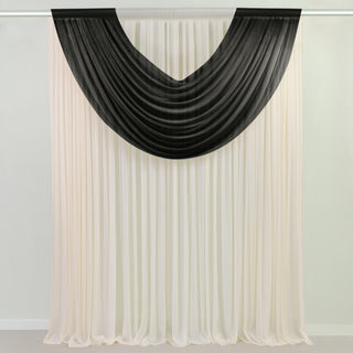 Black and white draped curtain fabric in studio-style isolation shot