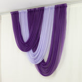 Purple and lavender draped sheer curtains hanging elegantly.