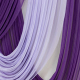 Purple and lavender sheer fabric drapes elegantly in soft folds.