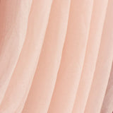 Soft pink tulle fabric draped elegantly. #whtbkgd
