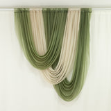 Elegant green and cream sheer drapery fabric display.