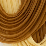 Close-up of gold sheer curtain fabric folds