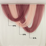 Draped burgundy and blush sheer fabric curtains 