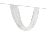 White sheer curtain draped on a rod, showcasing its flowy texture. 