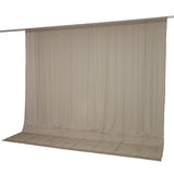 Beige sheer curtain panel on rod with floor-length drape#whtbkgd