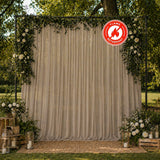 Outdoor wedding backdrop with floral arch and flame retardant drapery