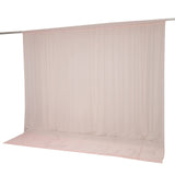 Beige sheer curtain on rod with matching floor-length drape backdrop#whtbkgd