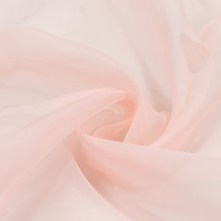 Soft blush pink abstract silk fabric background with flowing folds#whtbkgd