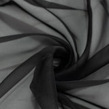 Abstract black sheer fabric swirl texture close-up#whtbkgd