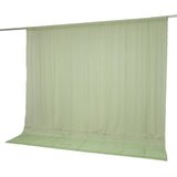 Light green sheer curtain panel on rod with matching floor-length drape#whtbkgd