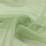 Light green sheer fabric with soft folds and translucent texture#whtbkgd