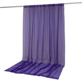Purple sheer curtain panel with rod pocket hanging on a curtain rod