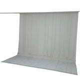 Light gray sheer curtain backdrop with floor panel on hanging rod