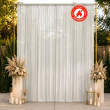 Elegant white wedding backdrop with floral arrangements and candles, flame retardant