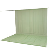Light green sheer curtain backdrop with floor panel and hanging rod
