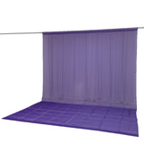 Purple sheer curtain and floor drape on hanging backdrop stand