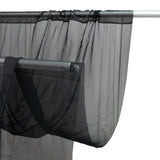 Black sheer curtain draped on a curtain rod against a white background #whtbkgd